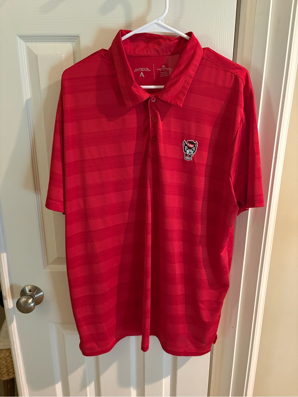 Antigua Men's NC State Wolfpack Red Striped Polo with Embroidered Wolf Logo